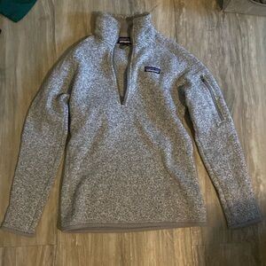 Patagonia sweater with zipper pocket on sleeve